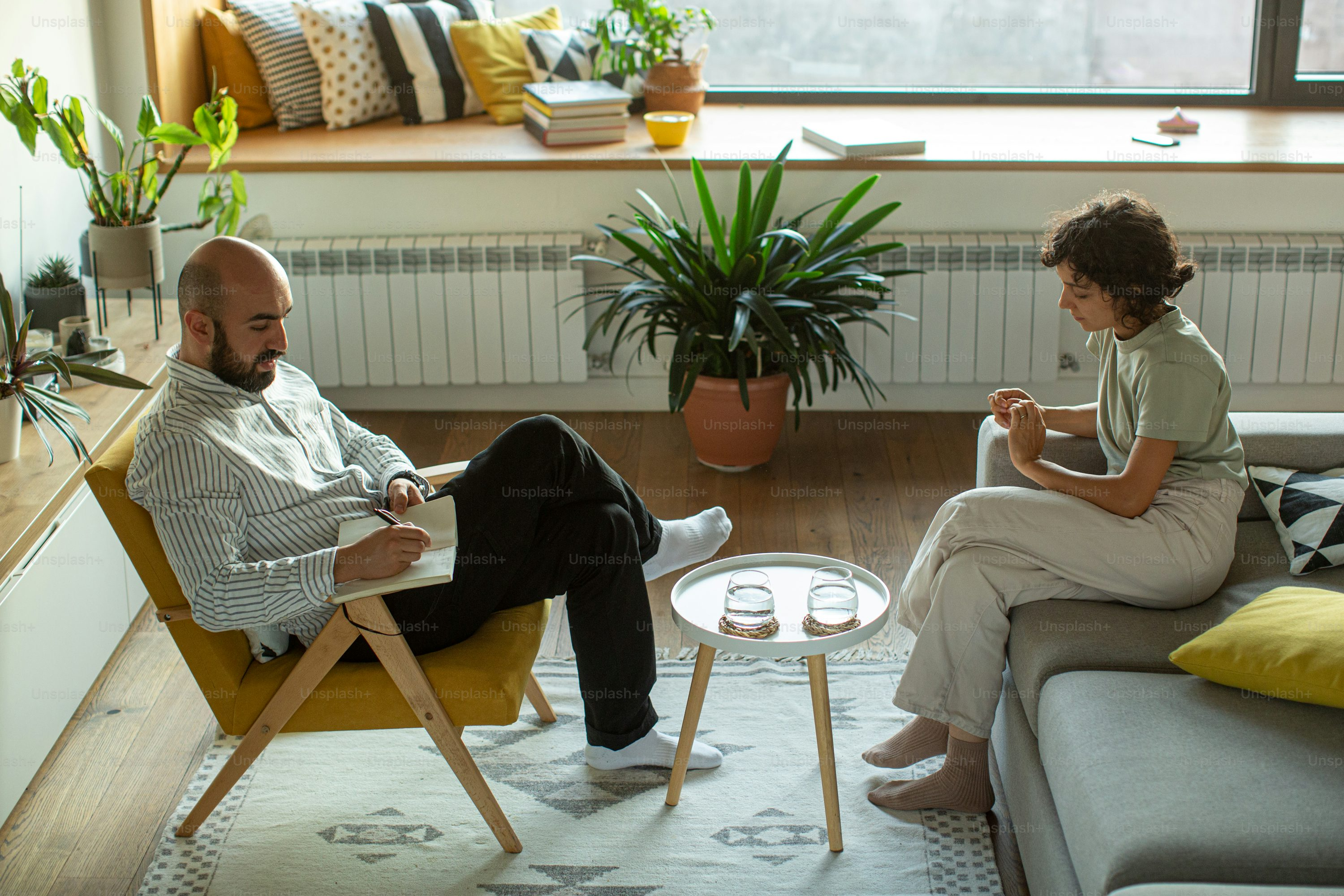Men and Women sitting in cozy room
